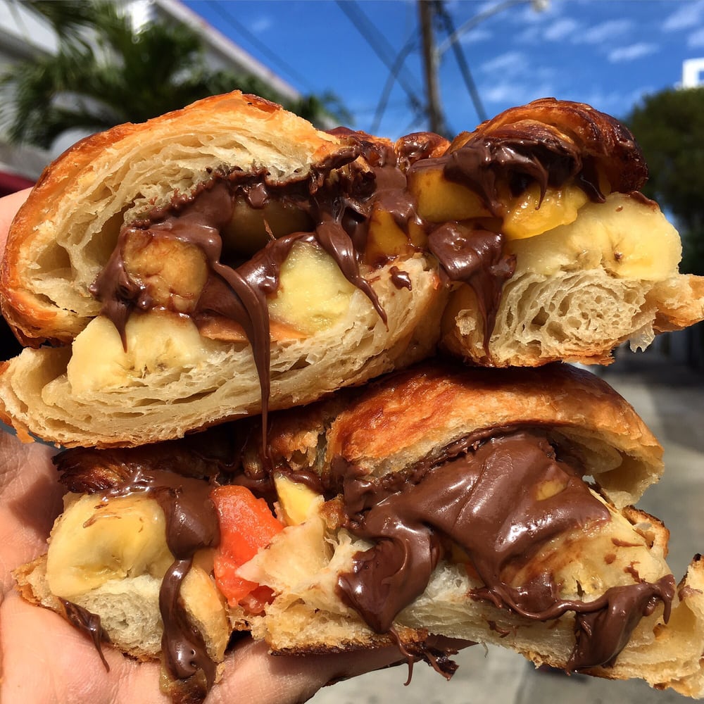 Sweet croissant with banana, strawberries, and chocolate spread at La Sandwicherie
