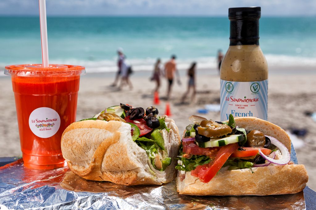 Sandwich and drink on a beach