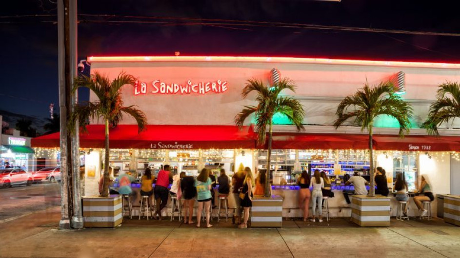 La Sandwicherie restaurant at night with outdoor seating in Miami Beach